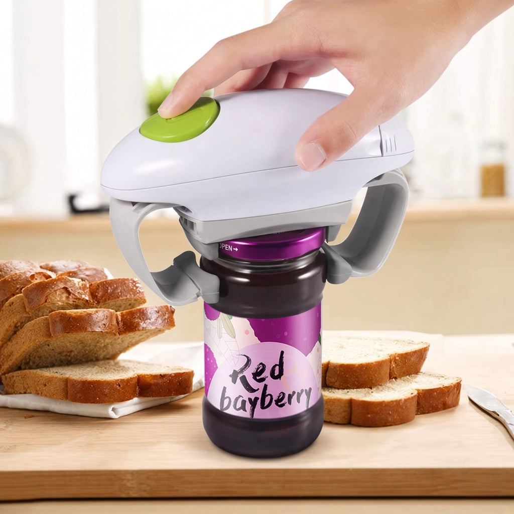 Handheld electric jar opener opening a jar lid in the kitchen