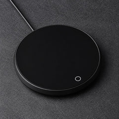 Black USB mug warmer coaster with a lit power ring